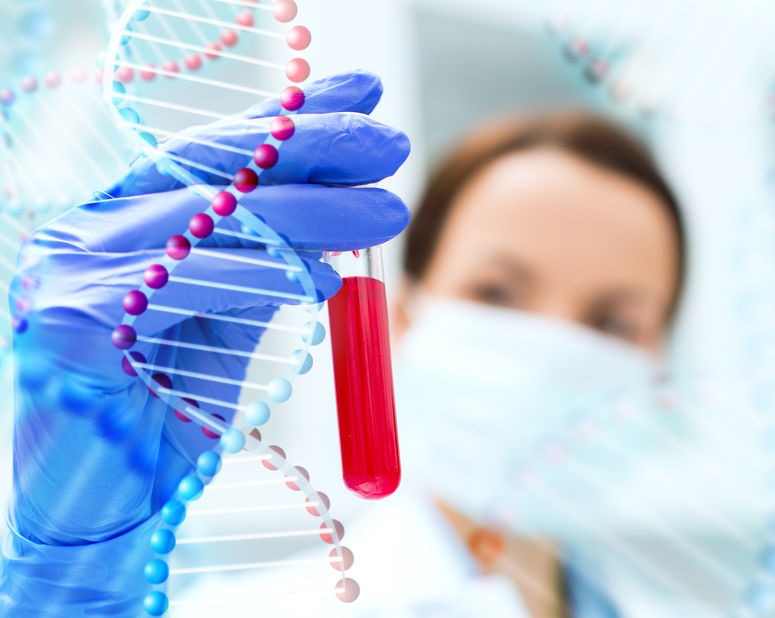 close up of scientist holding test tube in lab